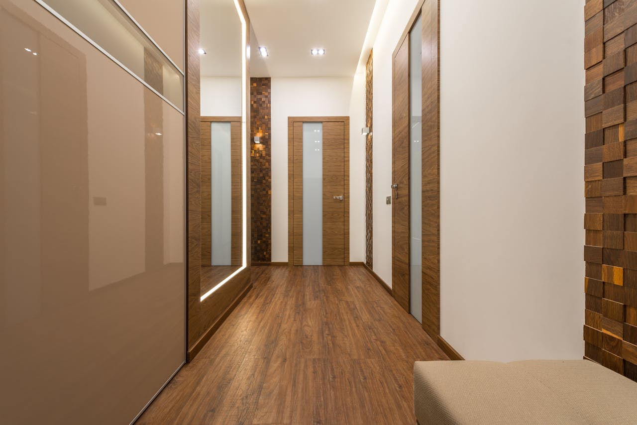 Home Sleek and luxurious hallway featuring wooden elements, elegant lighting, and modern design.